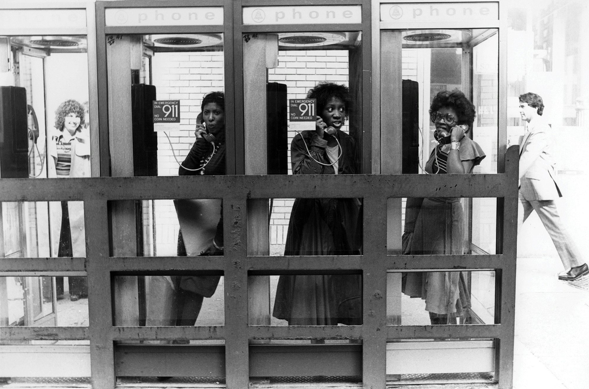 Nona Hendryx, Patti LaBelle, and Sarah Dash pose in phone booths. Photo by Richard E. Aaron/Redferns.